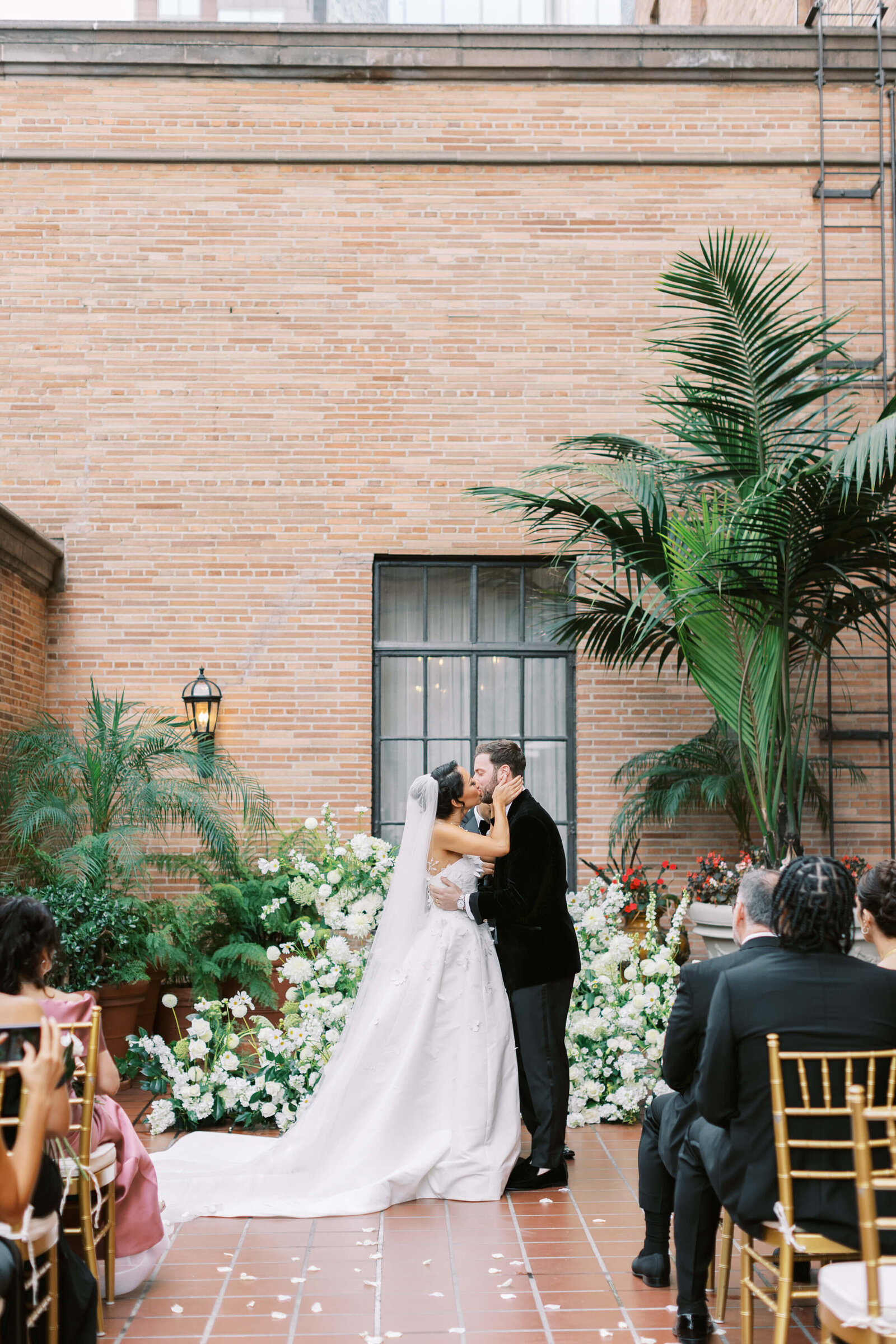 California Club Rooftop Wedding Ceremony Kiss