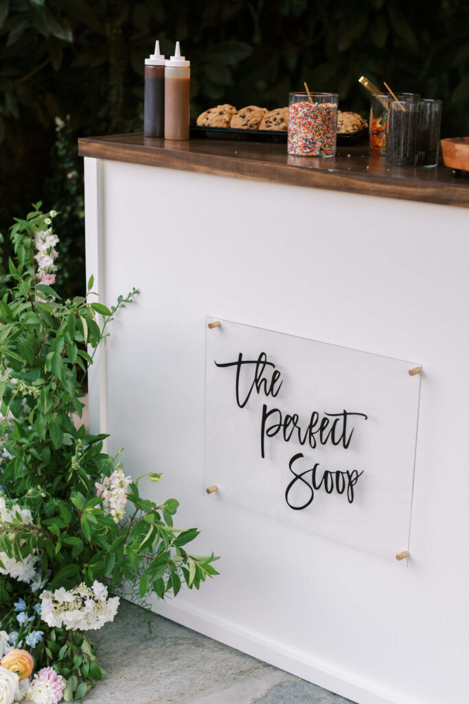 A white counter with a sign reading 
