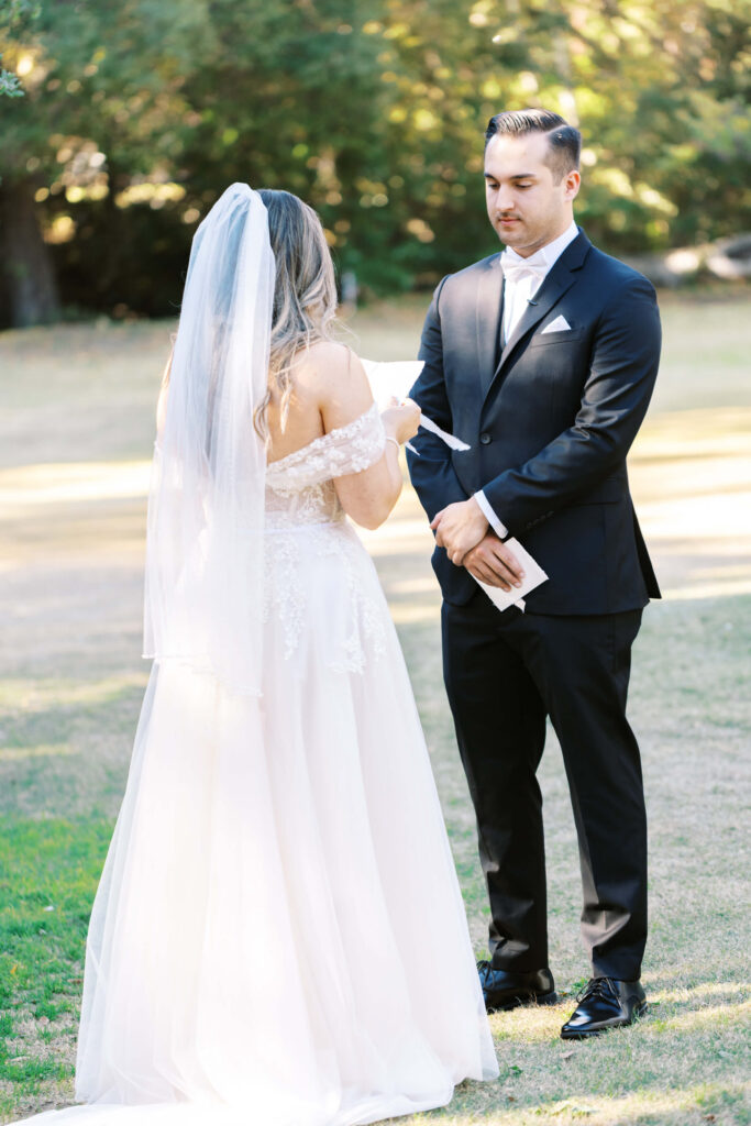 Bride reading vows during First Look at Calamigos Ranch - Lisa Leanne Photography